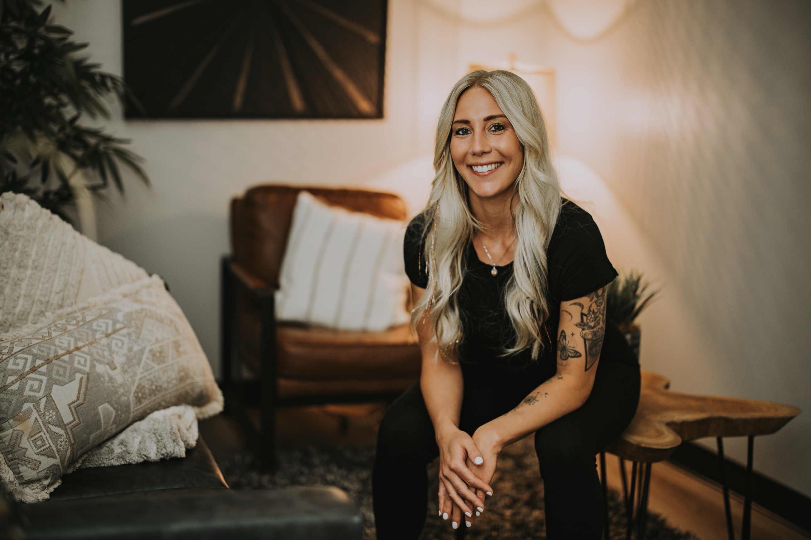 Shelly Radack, licensed massage therapist and esthetician, smiling in her studio